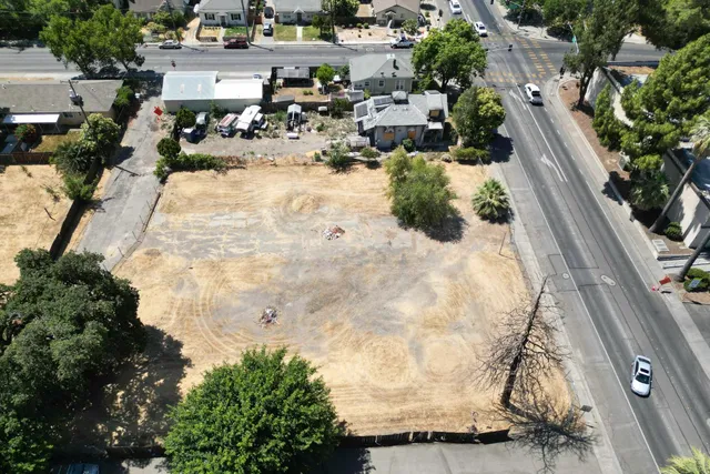 a view of swimming pool with outdoor seating and plants