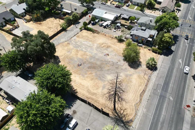 an aerial view of residential houses with outdoor space
