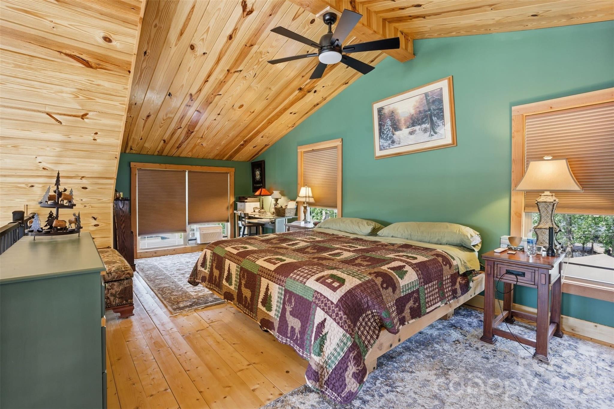 4473 Ridge Street Claremont, NC 28610 - Photo 12 of 26 a bedroom with a bed and a table