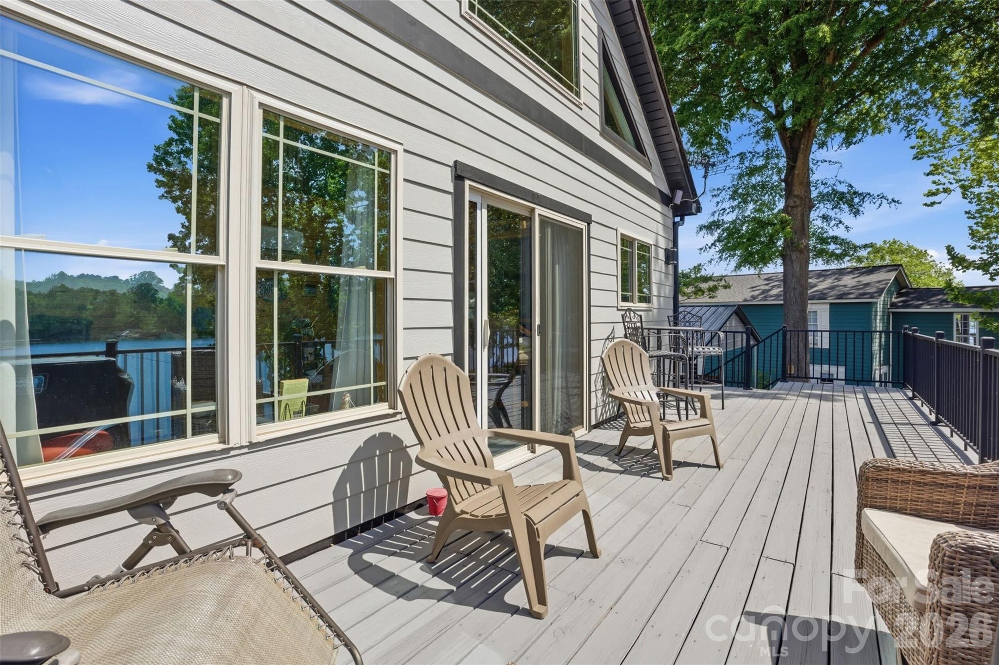 4473 Ridge Street Claremont, NC 28610 - Photo 17 of 26 a view of balcony with wooden floor and outdoor seating