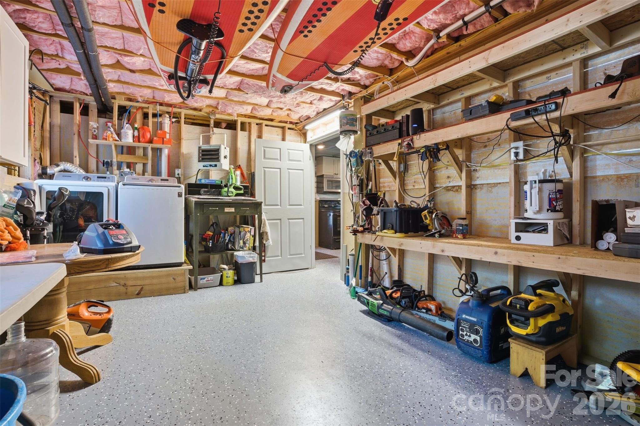 4473 Ridge Street Claremont, NC 28610 - Photo 21 of 26 a storage room with lots of clutter