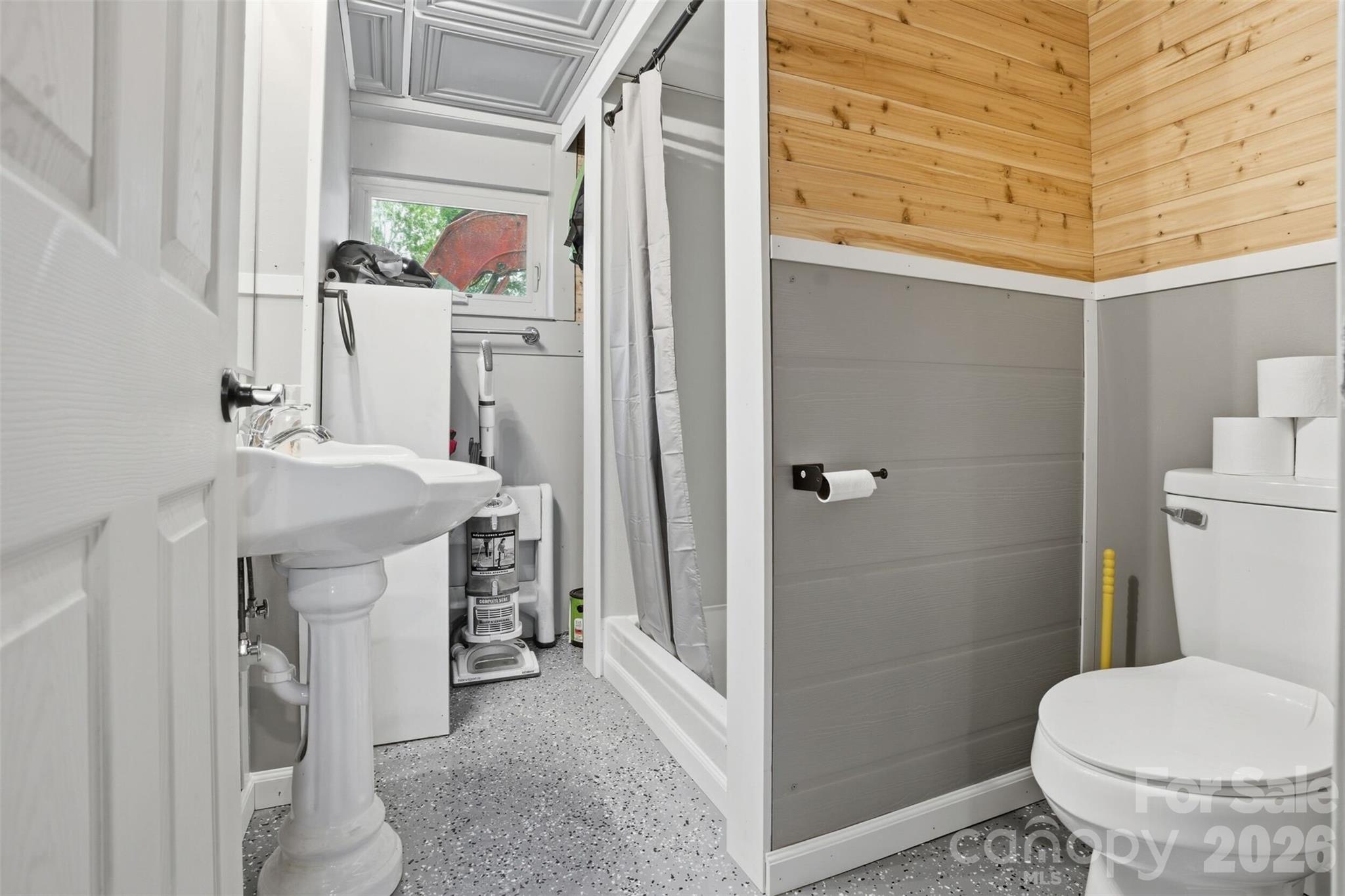 4473 Ridge Street Claremont, NC 28610 - Photo 23 of 26 a bathroom with a sink toilet and shower
