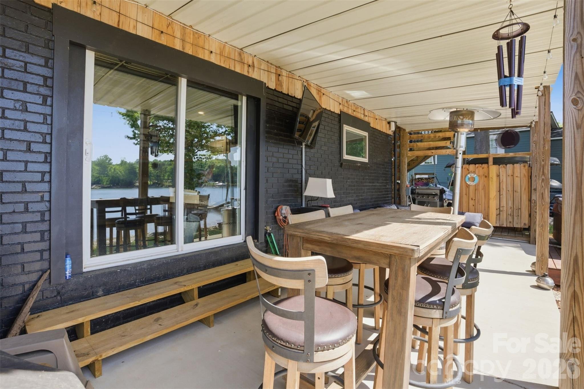 4473 Ridge Street Claremont, NC 28610 - Photo 5 of 26 a patio with a table and chairs