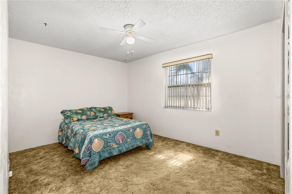 693 Reillys Road Port Orange, FL 32127 - Photo 22 of 31 a bedroom with a bed and window