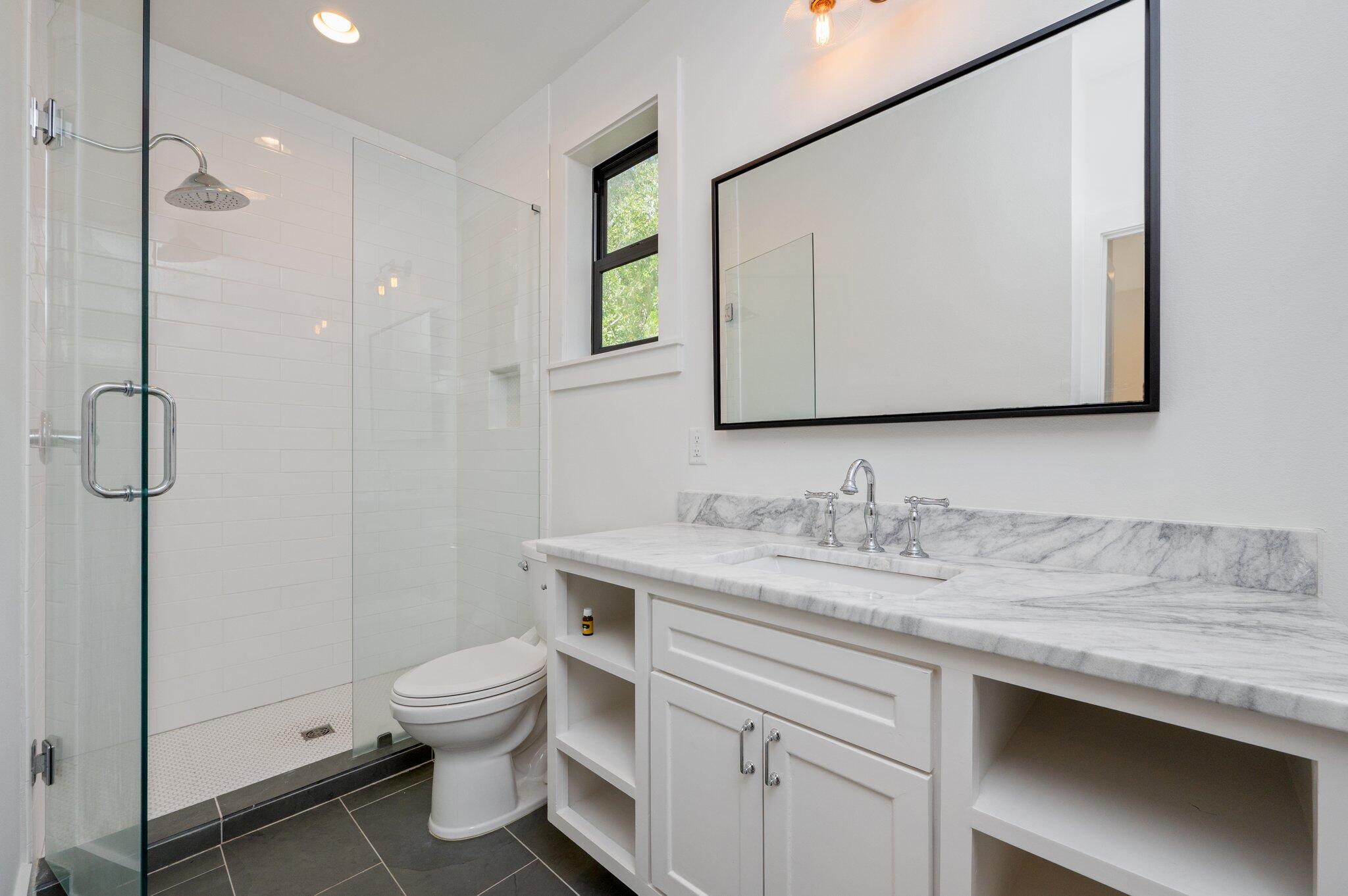 164 Bay Trace Santa Rosa Beach, FL 32459 - Photo 84 of 90 a bathroom with a granite countertop toilet sink and mirror
