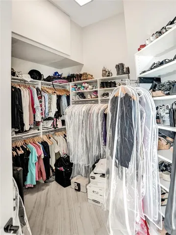 a bathroom with a granite countertop tub sink and mirror