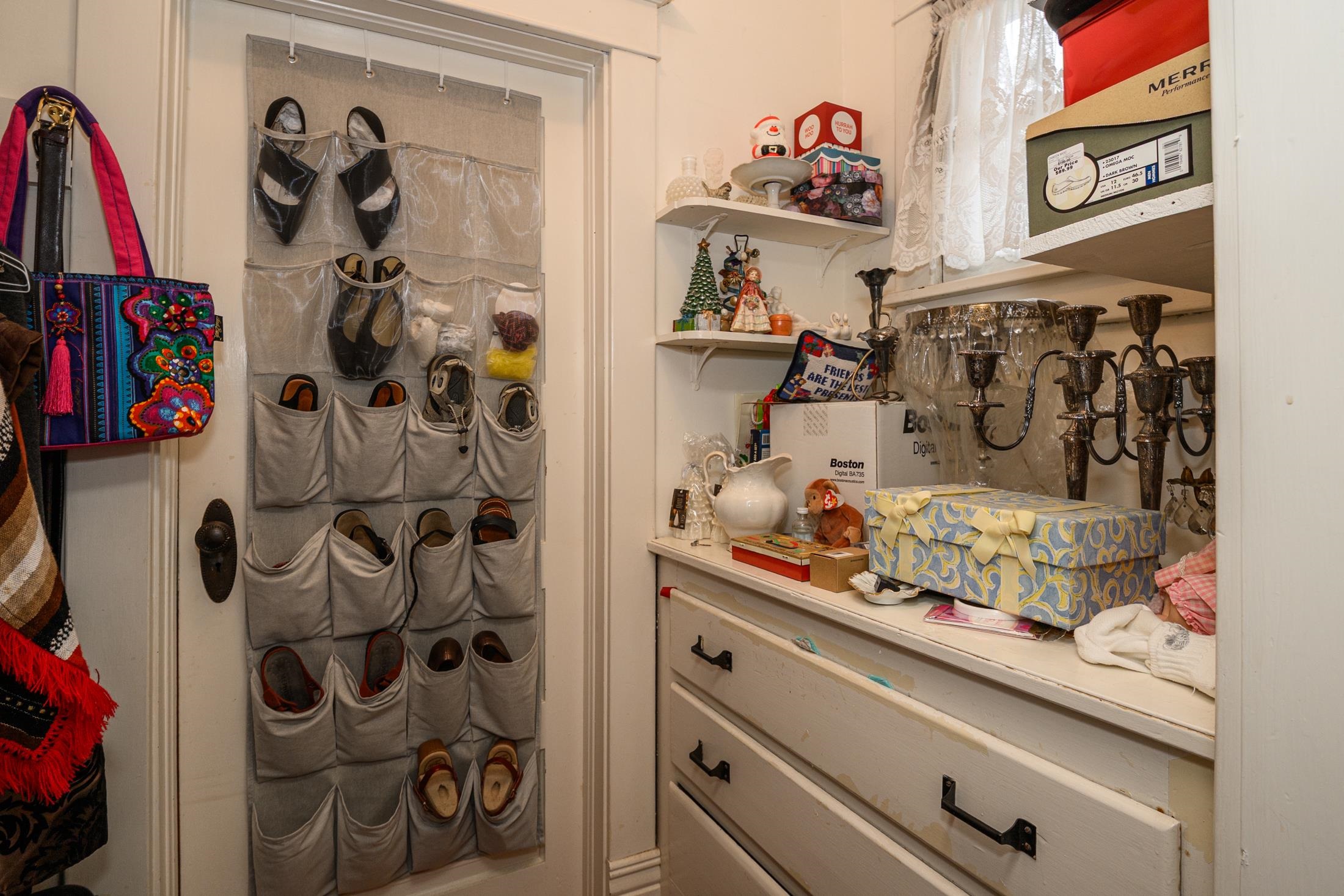 24 Saragossa Street St. Augustine, FL 32084 - Photo 47 of 99 a view of walk in closet with clothes and shoes