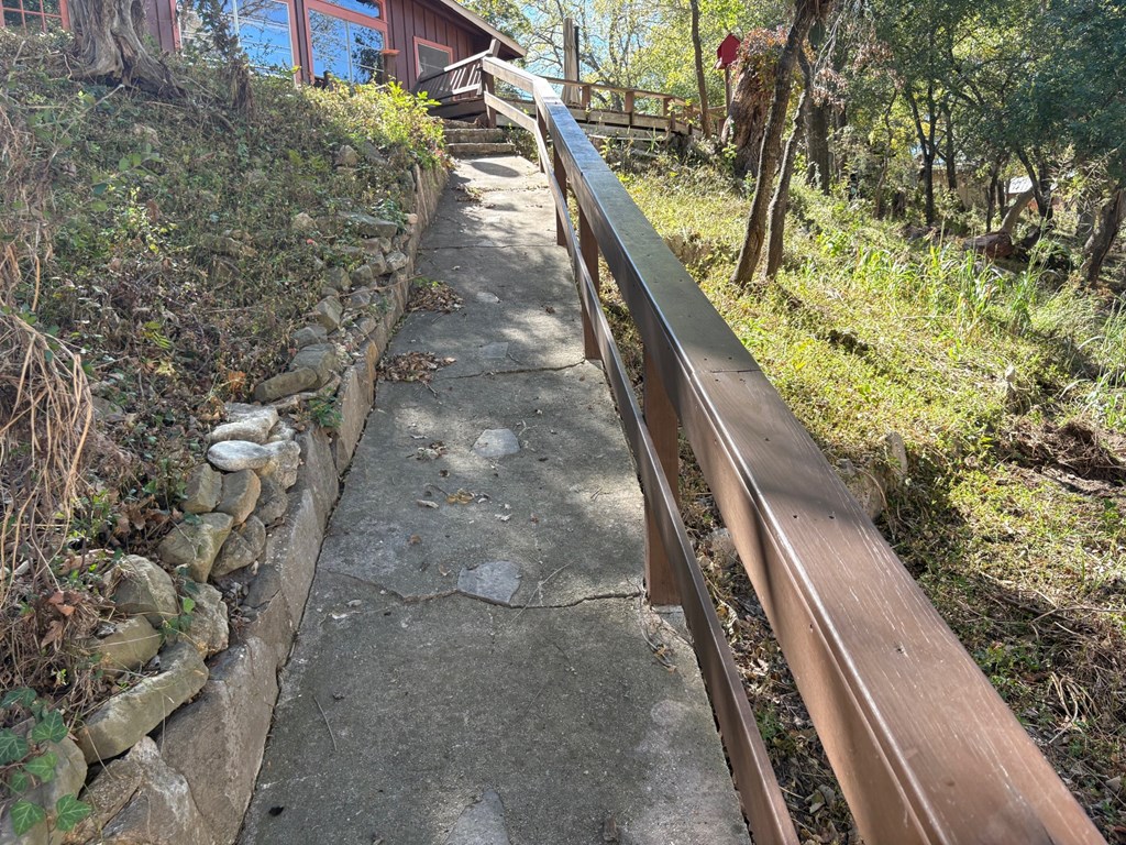 2714 Highway 39 Hunt, TX 78024 - Photo 4 of 6 a view of a balcony with wooden floor and fence