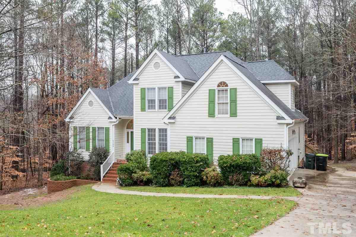 5704 Dunstan Court Raleigh, NC 27613 - Photo 1 of 23 a front view of a house with a yard and potted plants