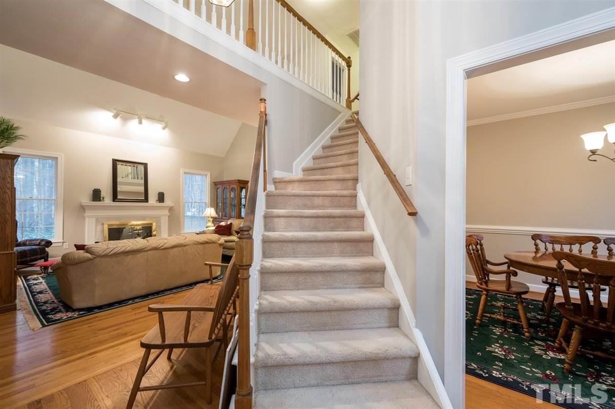5704 Dunstan Court Raleigh, NC 27613 - Photo 2 of 23 a view of a livingroom with furniture and stairs