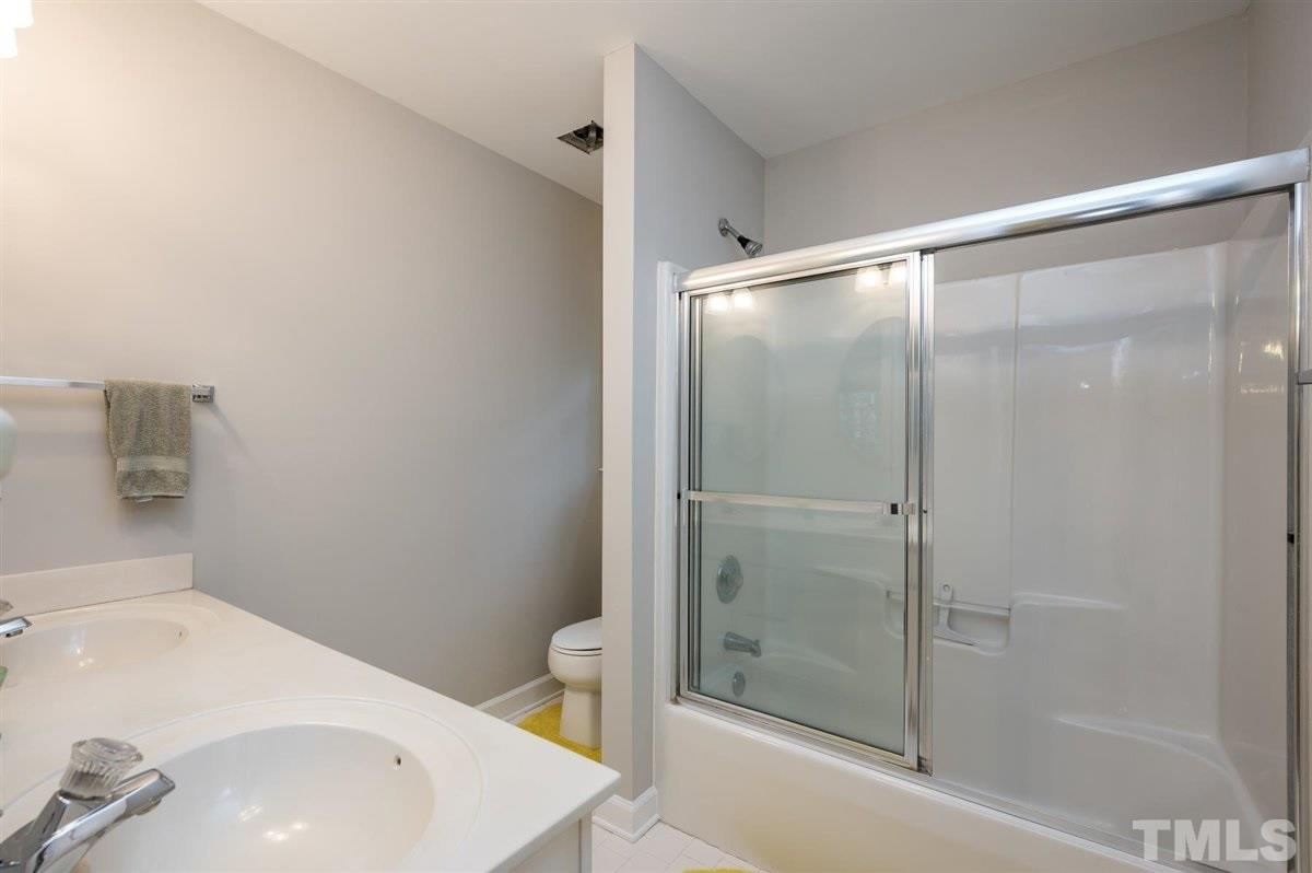 5704 Dunstan Court Raleigh, NC 27613 - Photo 17 of 23 a bathroom with a sink and a bathtub