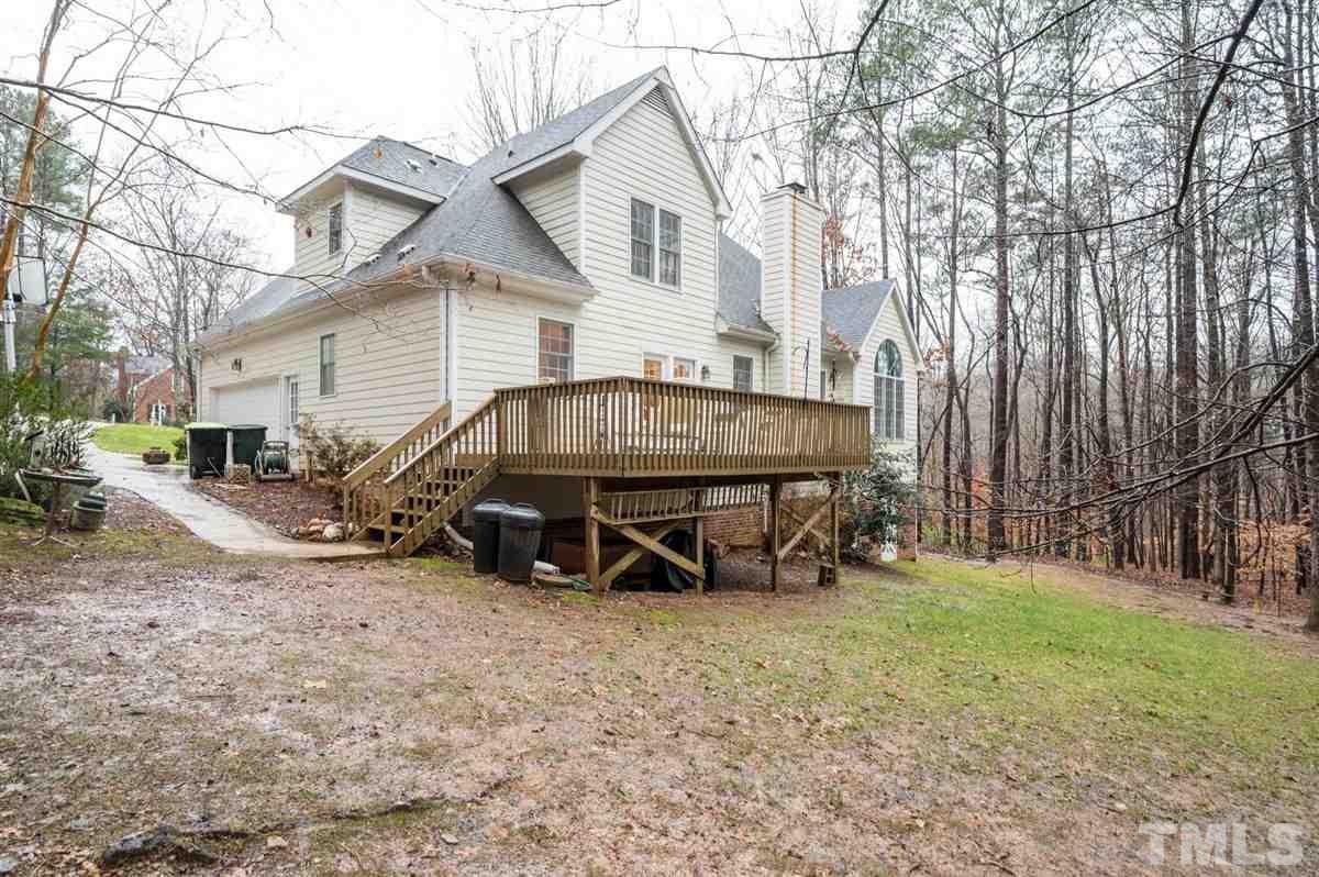 5704 Dunstan Court Raleigh, NC 27613 - Photo 21 of 23 a view of a house with backyard