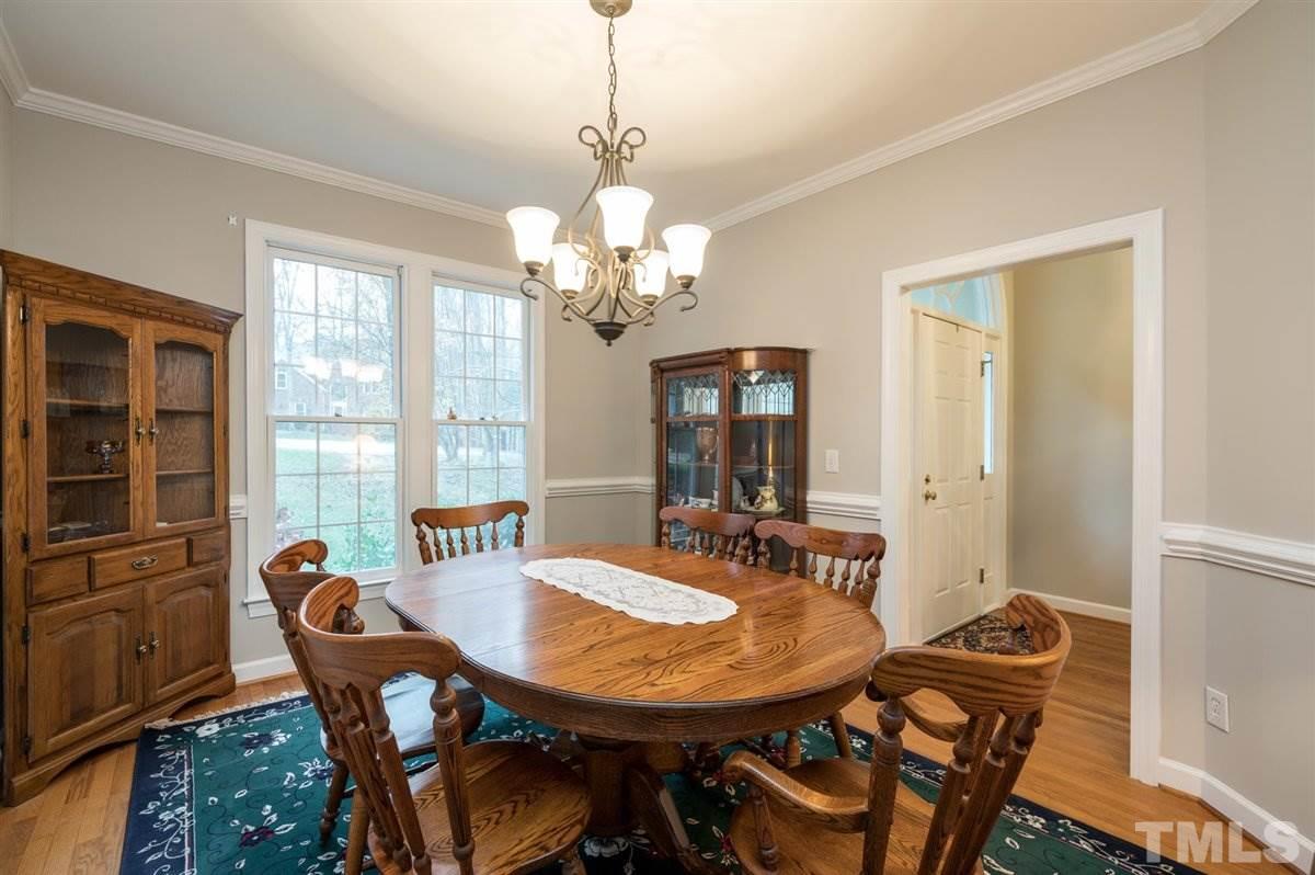 5704 Dunstan Court Raleigh, NC 27613 - Photo 6 of 23 a view of a dining room with furniture window and outside view