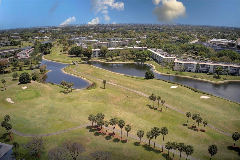 1601 Abaco Drive, Unit D1 Coconut Creek, FL 33066 - Photo 25 of 25 an aerial view of residential houses with outdoor space