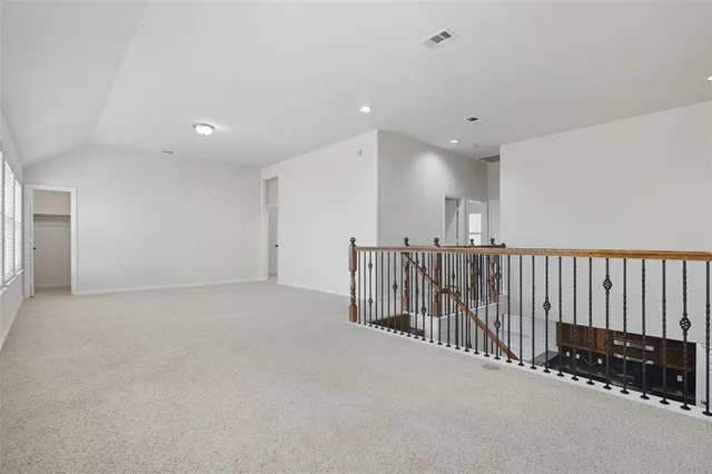 a view of a hall with stairs