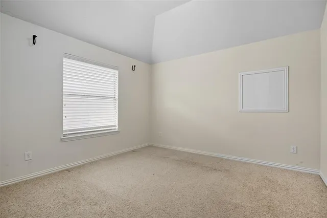 a backyard of a house with barbeque oven and wooden floor