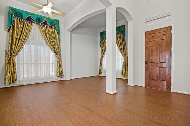 a view of an entryway with wooden floor