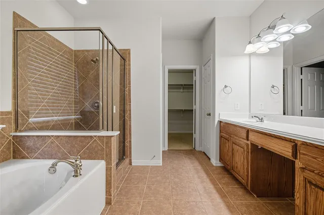 a bathroom with a bathtub and a sink