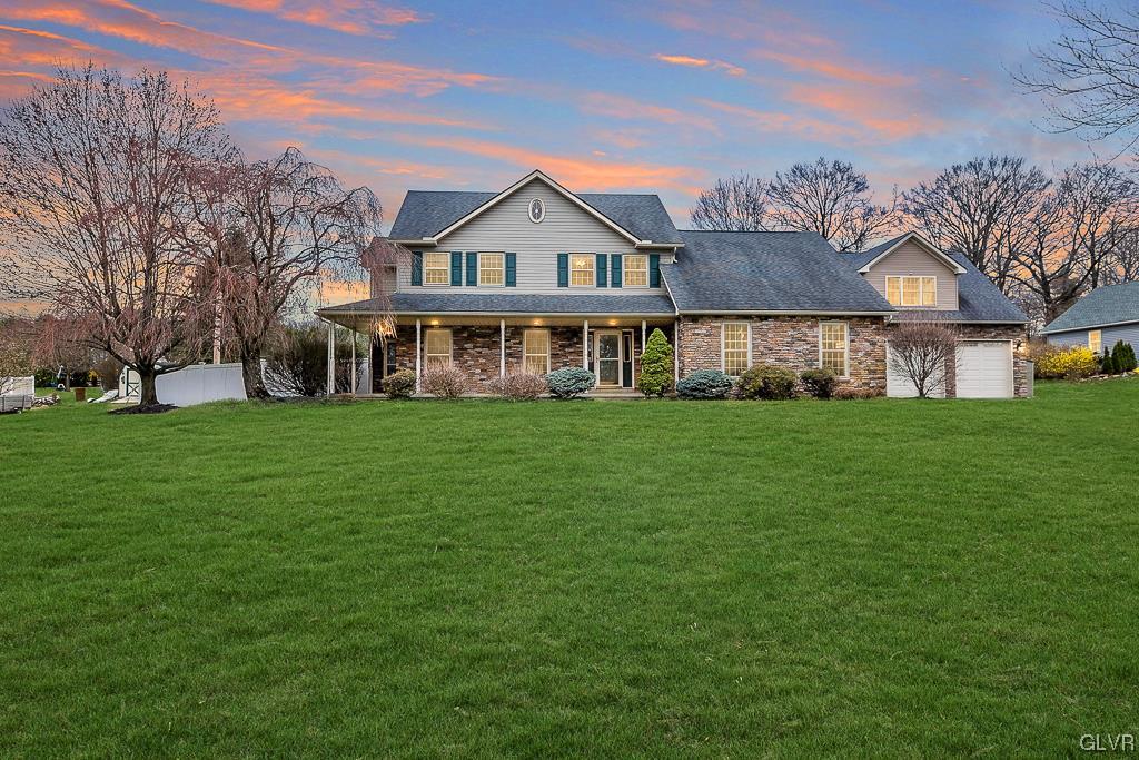 973 Renaldi Road Wind Gap, PA 18091 - Photo 1 of 50 a view of a house next to a big yard and large trees