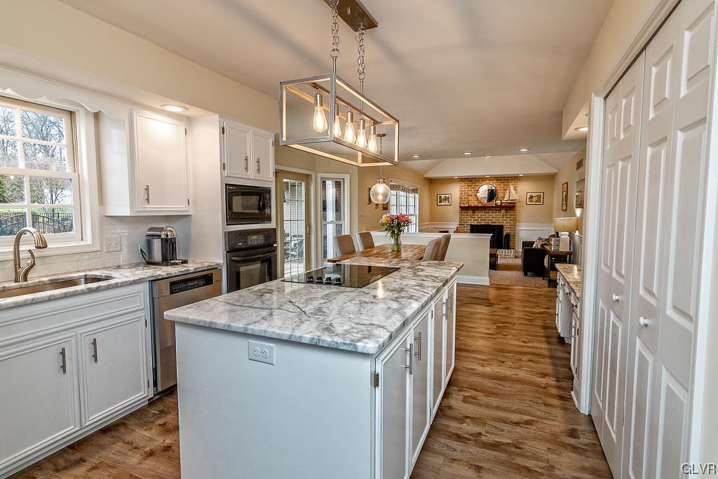 973 Renaldi Road Wind Gap, PA 18091 - Photo 12 of 50 a kitchen with stainless steel appliances granite countertop lots of counter top space and wooden floor