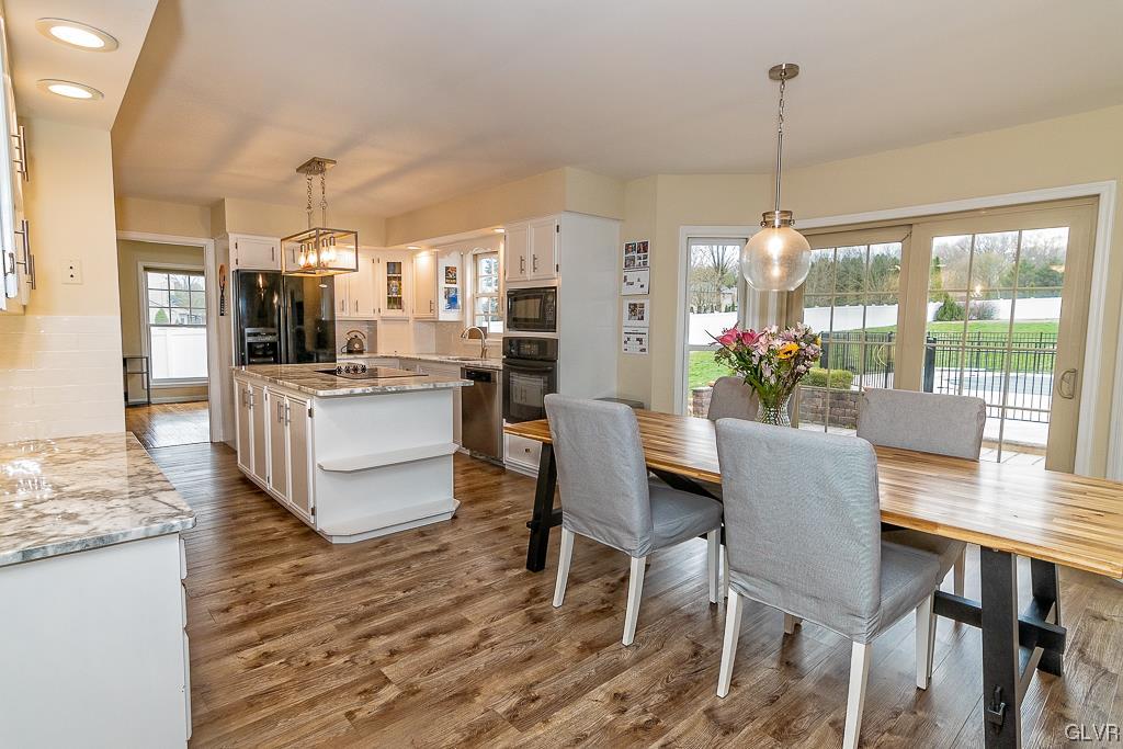 973 Renaldi Road Wind Gap, PA 18091 - Photo 16 of 50 a dining room with furniture a chandelier and wooden floor