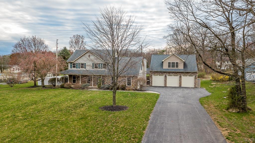 973 Renaldi Road Wind Gap, PA 18091 - Photo 2 of 50 a front view of a house with a yard and trees