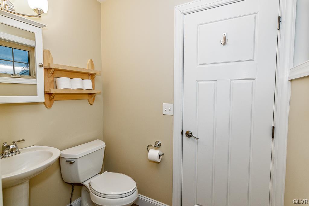 973 Renaldi Road Wind Gap, PA 18091 - Photo 40 of 50 a white toilet sitting next to a bathroom sink