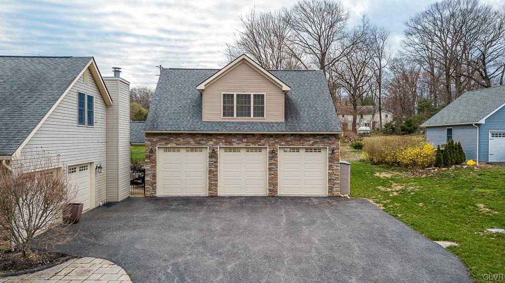 973 Renaldi Road Wind Gap, PA 18091 - Photo 7 of 50 a front view of a house with a yard and garage