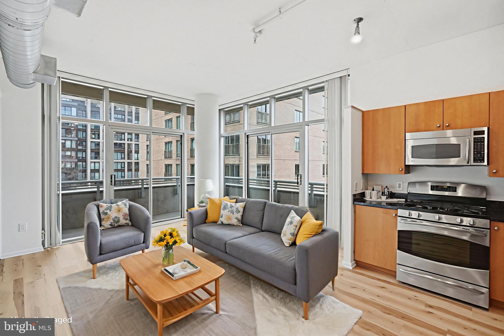 811 4th Street Northwest, Unit 404 Washington, DC 20001 - Photo 6 of 23 Two Walls of Windows, Sliding Doors to Balcony