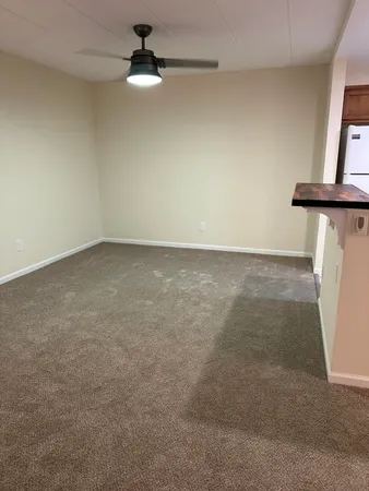 a view of an empty room with a window