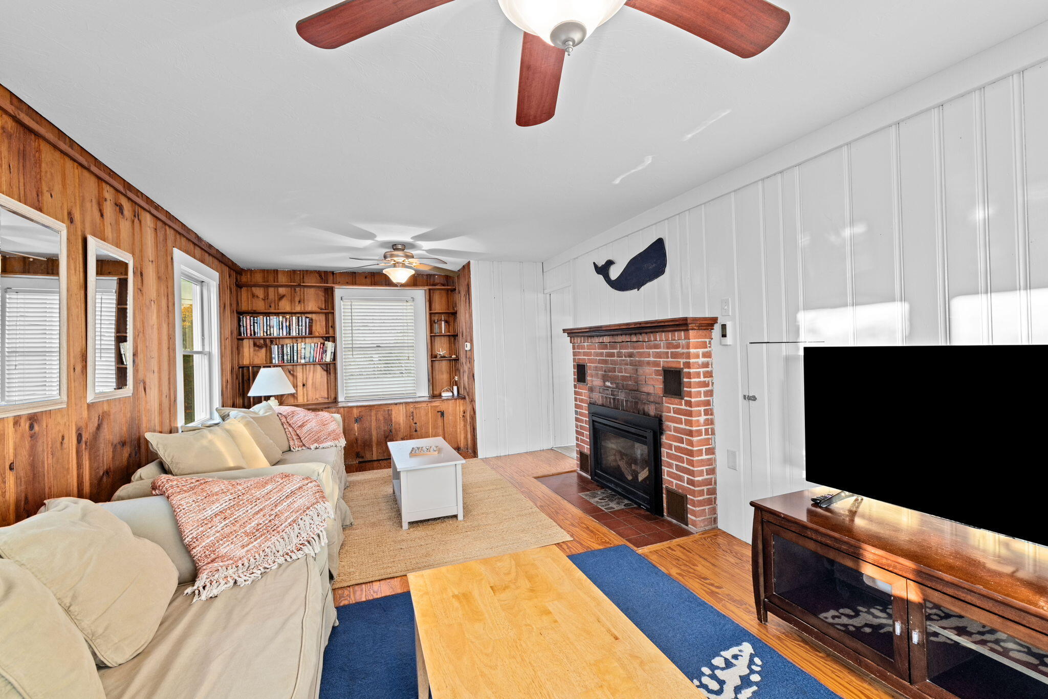 133 Phillips Road Sagamore Beach, MA 02562 - Photo 12 of 44 a living room with furniture fireplace and flat screen tv
