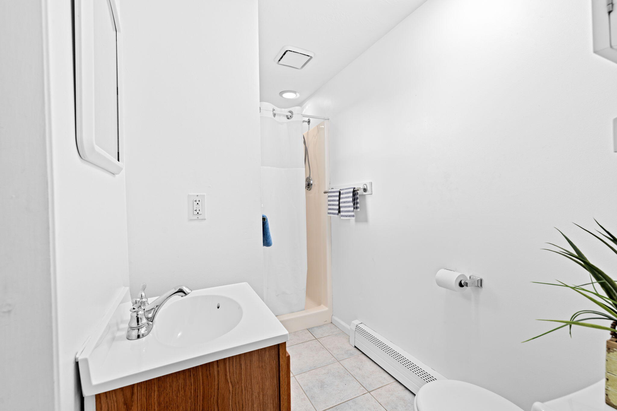 133 Phillips Road Sagamore Beach, MA 02562 - Photo 19 of 45 a bathroom with a sink a toilet and shower