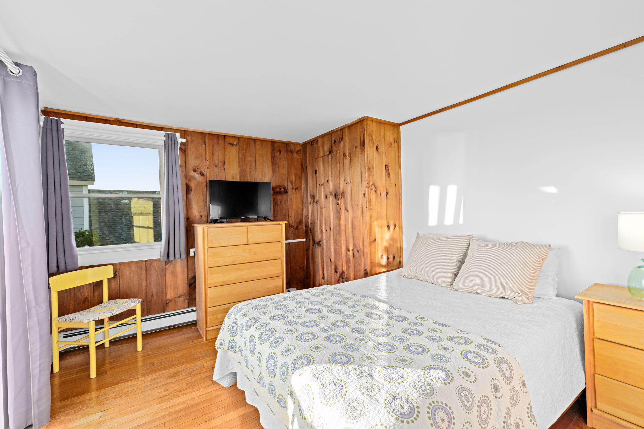 133 Phillips Road Sagamore Beach, MA 02562 - Photo 23 of 44 a bedroom with a bed and a flat screen tv