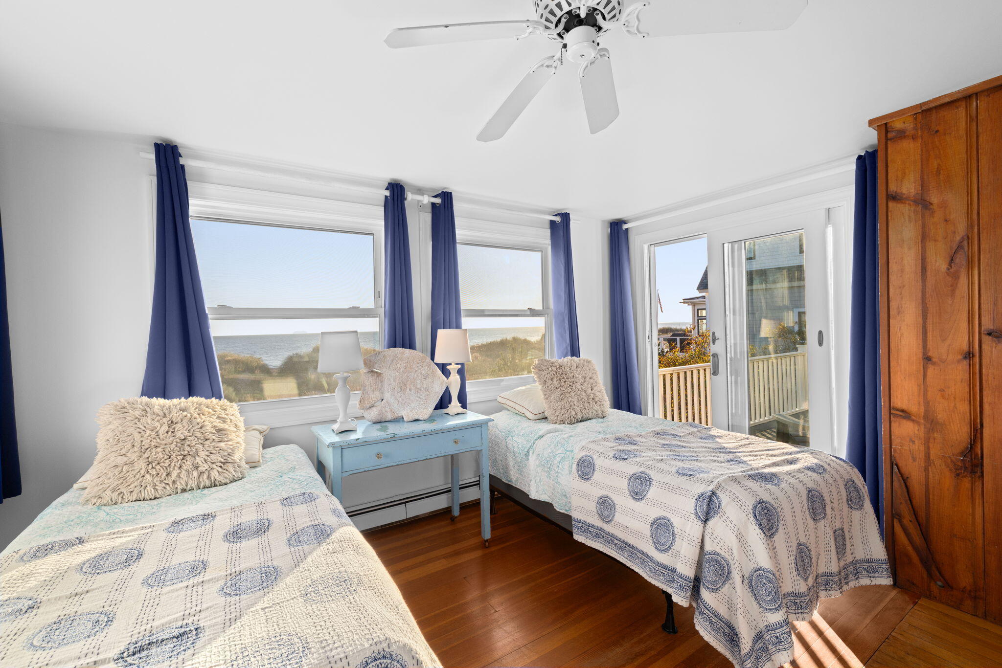 133 Phillips Road Sagamore Beach, MA 02562 - Photo 24 of 45 a bedroom with a bed lamp and a large window