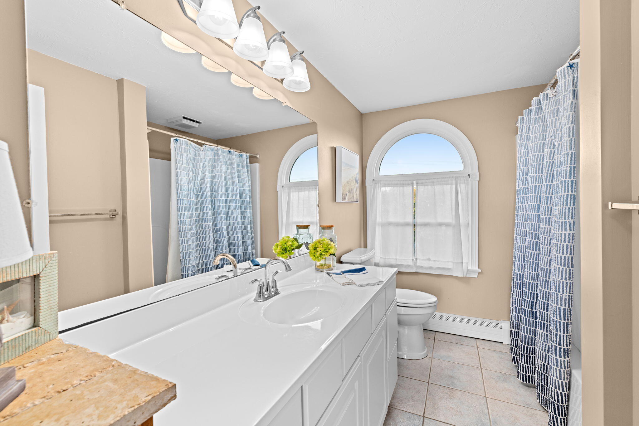 133 Phillips Road Sagamore Beach, MA 02562 - Photo 27 of 44 a spacious bathroom with a granite countertop sink a toilet and a bathtub