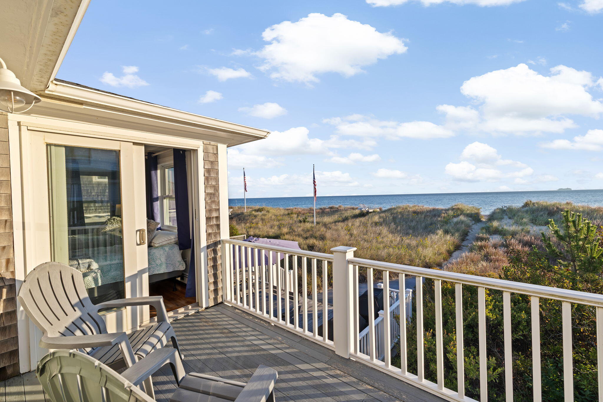 133 Phillips Road Sagamore Beach, MA 02562 - Photo 28 of 44 a view of a balcony with furniture