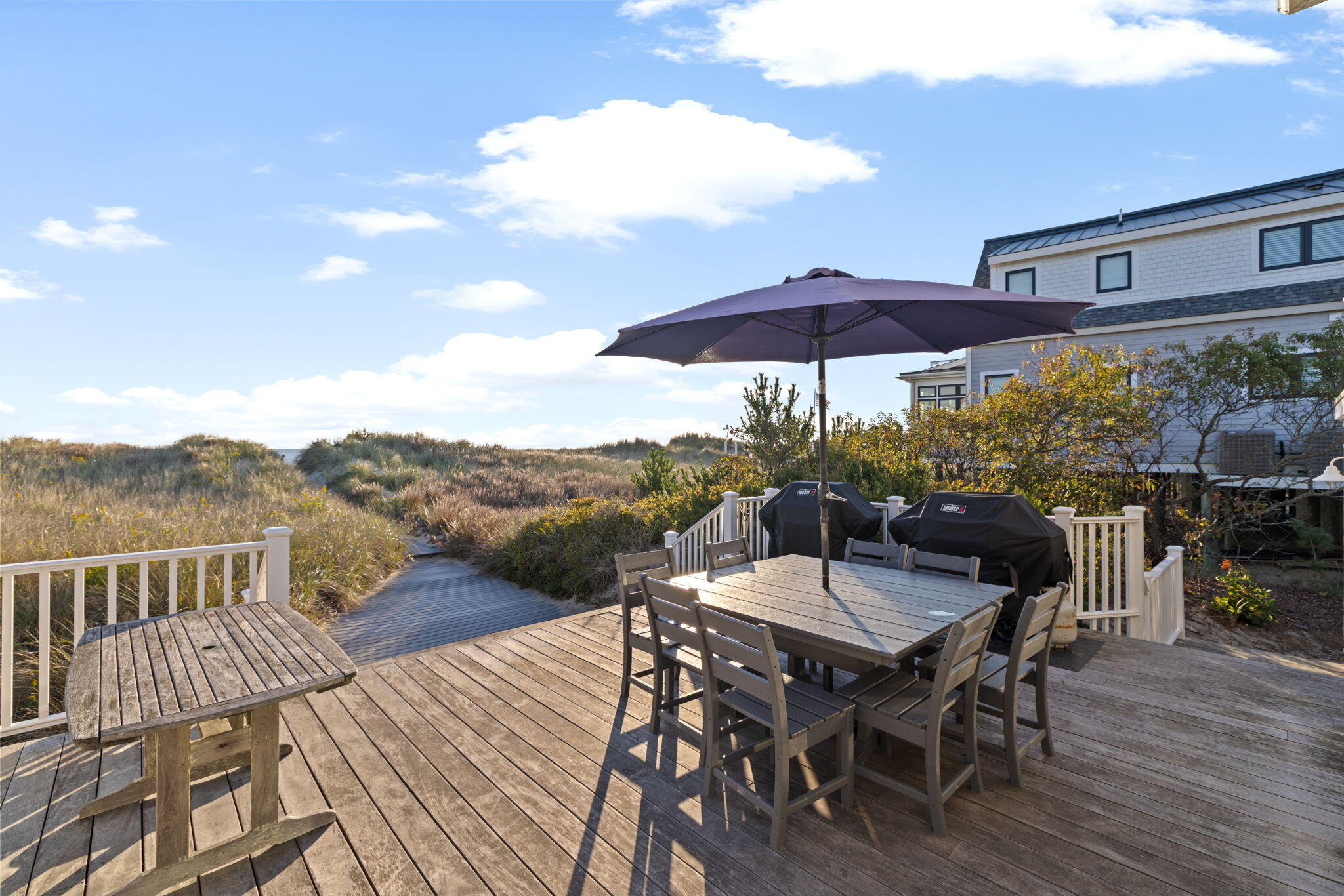 133 Phillips Road Sagamore Beach, MA 02562 - Photo 5 of 45 a view of a roof deck with furniture