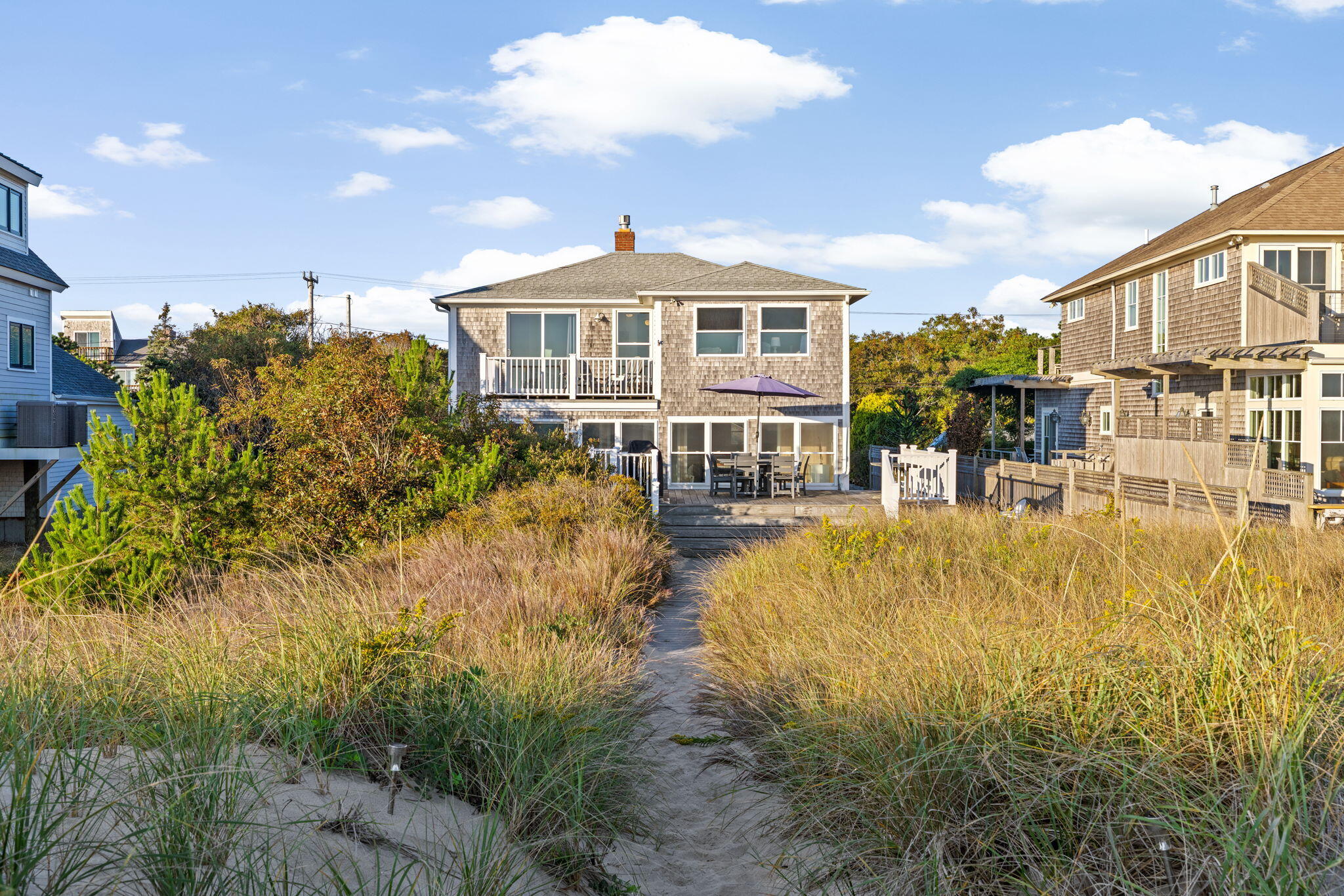 133 Phillips Road Sagamore Beach, MA 02562 - Photo 6 of 44 a swimming pool with outdoor seating and yard