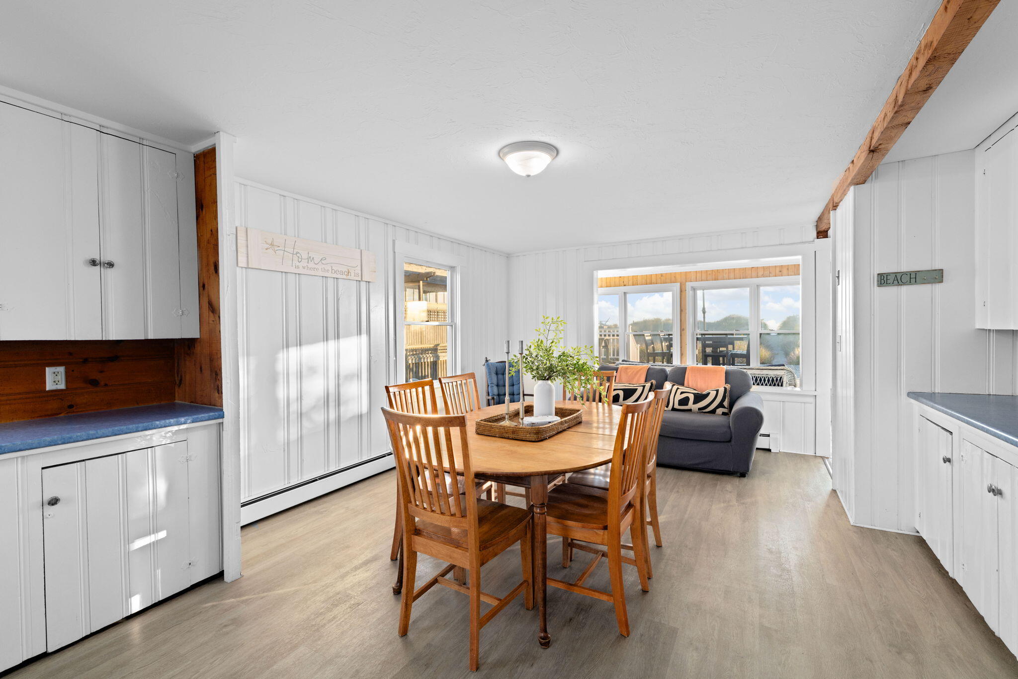 133 Phillips Road Sagamore Beach, MA 02562 - Photo 9 of 44 a view of a dining room with furniture and wooden floor