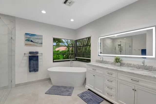 a view of a dining room and livingroom with furniture window and outside view