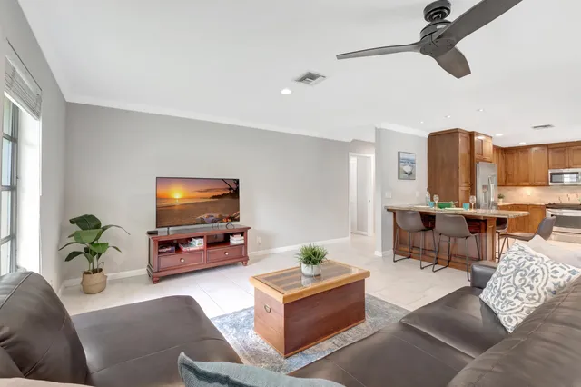 a kitchen with granite countertop a sink and a window