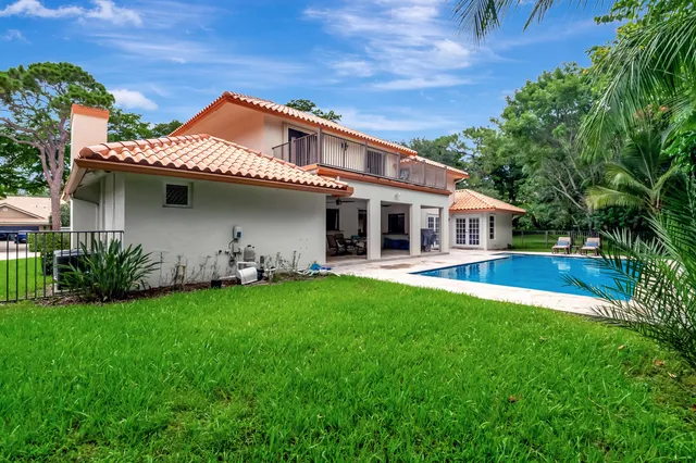 a view of a park with large trees