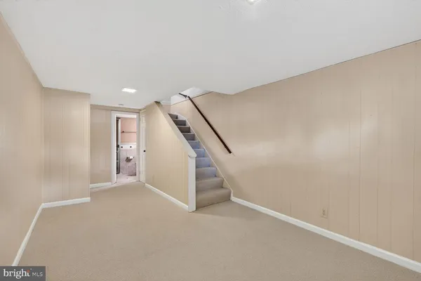 a view of room with closet and racks