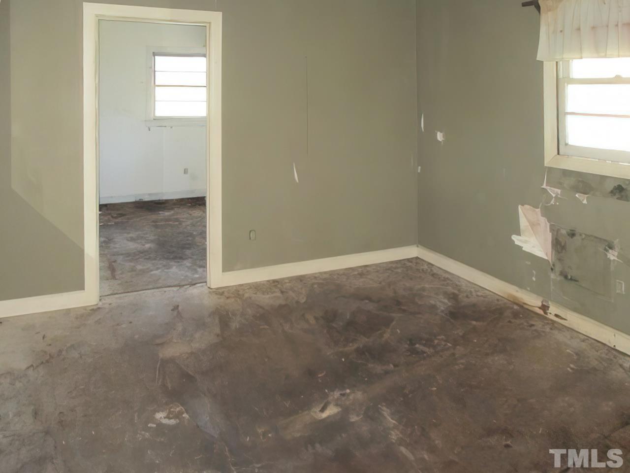 4915 Church Road Newton Grove, NC 28366 - Photo 8 of 15 an empty room that has a window