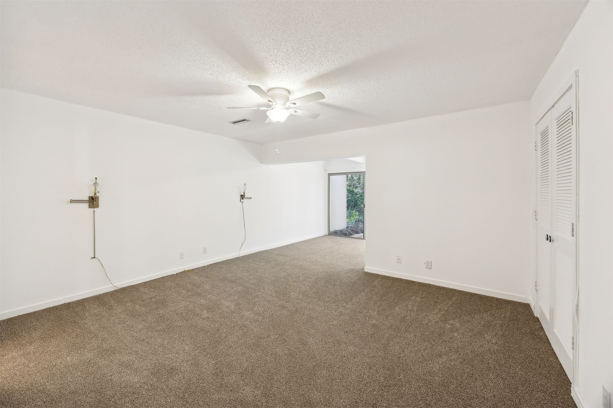 3207 Sea Marsh Road Fernandina Beach, FL 32034 - Photo 15 of 37 an empty room with a ceiling fan and a window