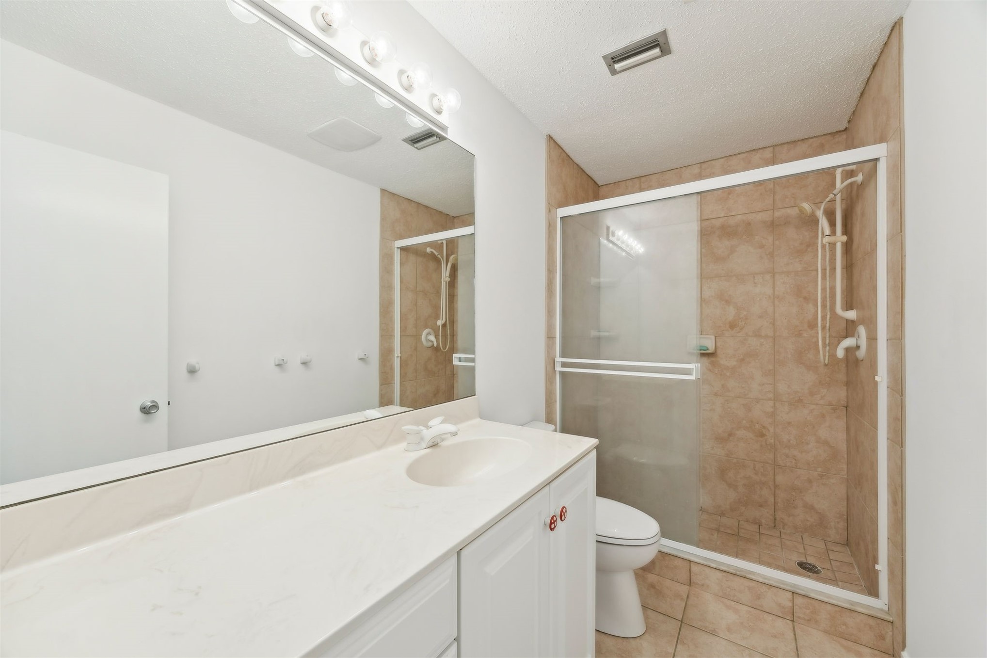 3207 Sea Marsh Road Fernandina Beach, FL 32034 - Photo 23 of 37 a bathroom with a sink a toilet and shower