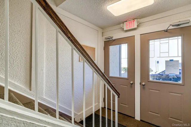 a view of staircase with wooden floor and stairs