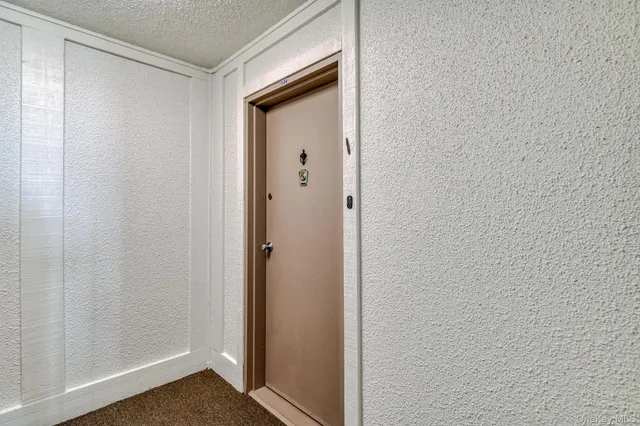 a view of a hallway with closet