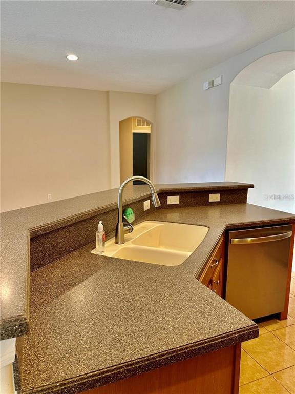 9249 Edistro Place New Port Richey, FL 34654 - Photo 20 of 82 a bathroom with a granite countertop sink and a mirror