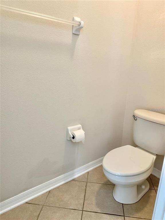 9249 Edistro Place New Port Richey, FL 34654 - Photo 39 of 82 a white toilet sitting next to a shower